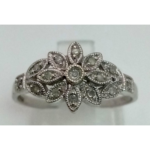 1195 - A 9K white gold ring with a beautiful diamond (0.15 carats) set design on top. Ring size: P, weight:... 