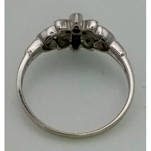 1195 - A 9K white gold ring with a beautiful diamond (0.15 carats) set design on top. Ring size: P, weight:... 