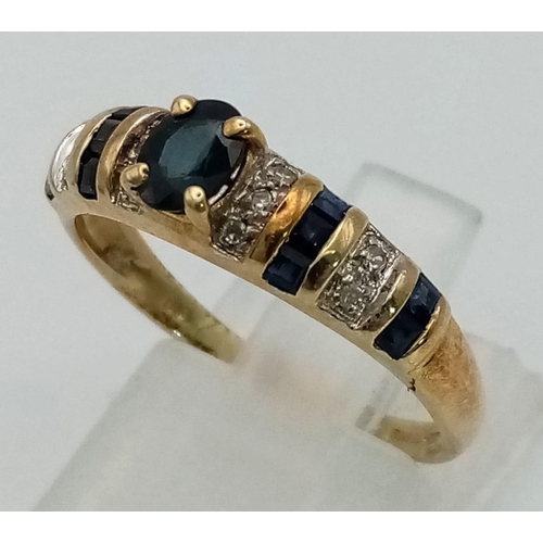 1324 - A 14K yellow gold ring with Ceylon blue sapphires and diamonds. Ring size: P, weight: 2.6 g.