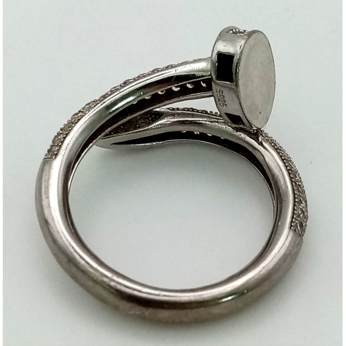 933 - Sterling Silver Stone Set Cartier style Nail ring.
Weighs 5.2g
Size P