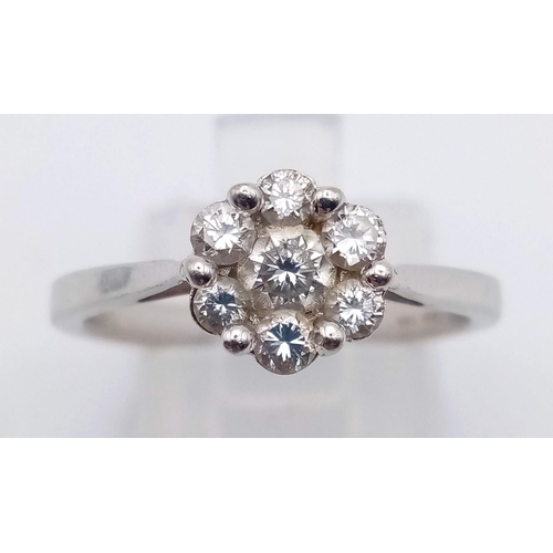 1159 - A 14K white gold, diamond (0.30 carats) cluster ring. Size: N, weight: 2.9 g.