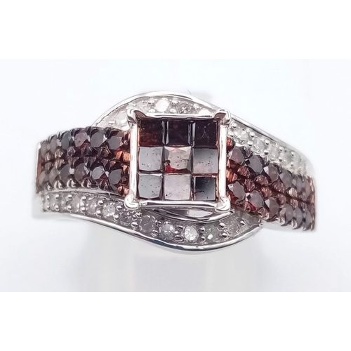 116 - A 10K White Gold and Cognac Diamond Crossover Ring. Nine square-cut central cognac-coloured diamonds... 