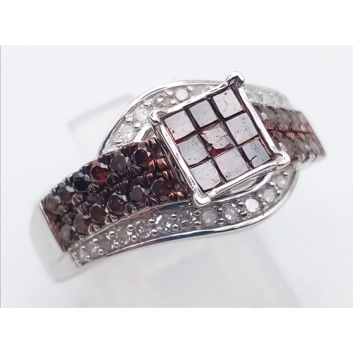 116 - A 10K White Gold and Cognac Diamond Crossover Ring. Nine square-cut central cognac-coloured diamonds... 