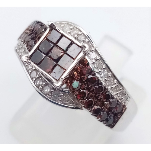 116 - A 10K White Gold and Cognac Diamond Crossover Ring. Nine square-cut central cognac-coloured diamonds... 