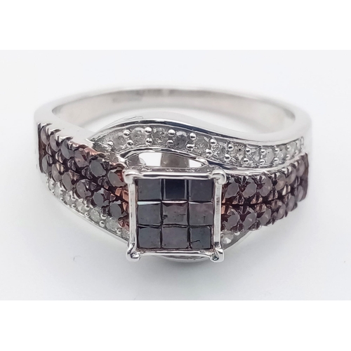 116 - A 10K White Gold and Cognac Diamond Crossover Ring. Nine square-cut central cognac-coloured diamonds... 