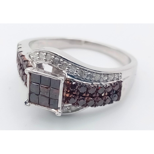 116 - A 10K White Gold and Cognac Diamond Crossover Ring. Nine square-cut central cognac-coloured diamonds... 