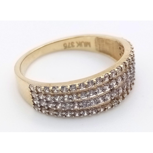 1194 - A 9K yellow gold ring with four stone set bands. Ring size: L. weight: 1.8 g.