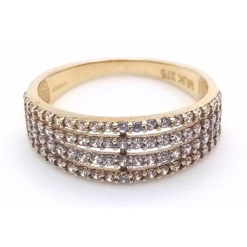 1194 - A 9K yellow gold ring with four stone set bands. Ring size: L. weight: 1.8 g.