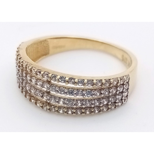 1194 - A 9K yellow gold ring with four stone set bands. Ring size: L. weight: 1.8 g.