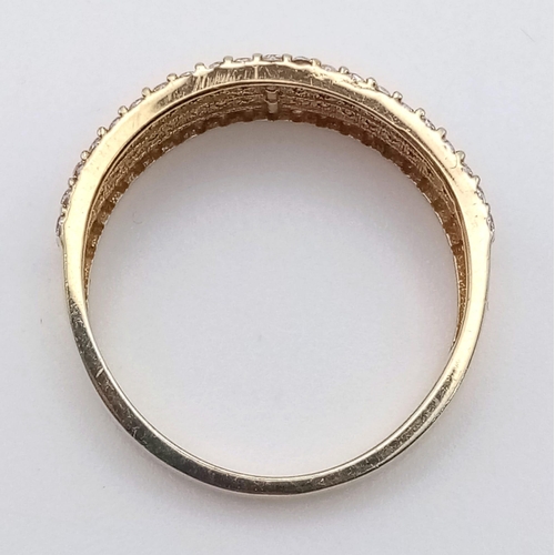 1194 - A 9K yellow gold ring with four stone set bands. Ring size: L. weight: 1.8 g.