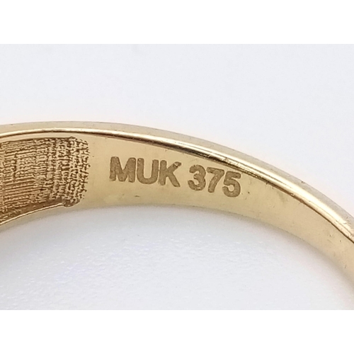 1194 - A 9K yellow gold ring with four stone set bands. Ring size: L. weight: 1.8 g.