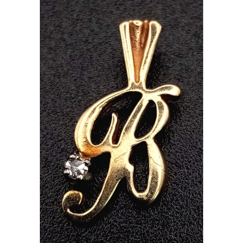 1225 - A 9K yellow gold, diamond set pendant/charm in the shape of letter B. Height: 15 mm, weight: 0.5 g.