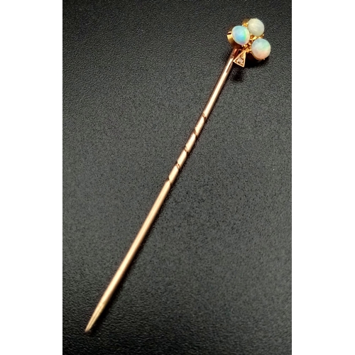 796 - A Victorian 15K Gold and Opal Trefoil Stickpin. 5.5cm. 1.1g total weight