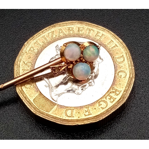 796 - A Victorian 15K Gold and Opal Trefoil Stickpin. 5.5cm. 1.1g total weight