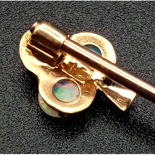 796 - A Victorian 15K Gold and Opal Trefoil Stickpin. 5.5cm. 1.1g total weight