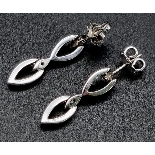 367 - 18K White Gold Diamond set drop earrings Weighs 6.4g