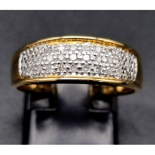 437 - 9K Yellow Gold Diamond Band Ring.
0.25ct Diamond
Weighs 2.44g
Size P