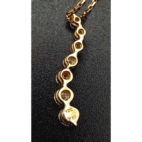 458 - 14K YELLOW GOLD TAPERING DIAMOND DROP PENDANT ON 18K YELLOW GOLD CHAIN, APPROX 0.60CT DIAMONDS AND W... 