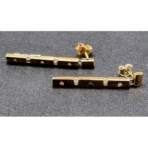 821 - 9k Yellow Gold Diamond set drop earrings Weighs 3.4g