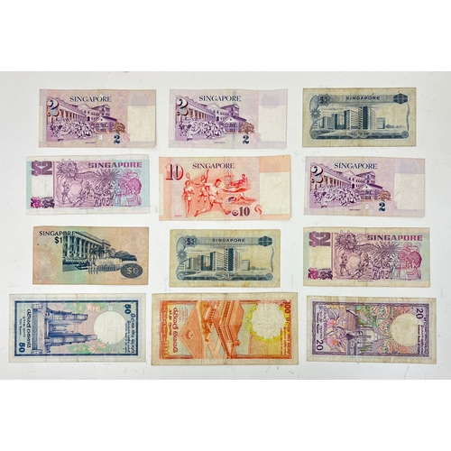 1264 - Twelve Vintage Singapore and Sri Lankan Currency Notes. please see photos for conditions.