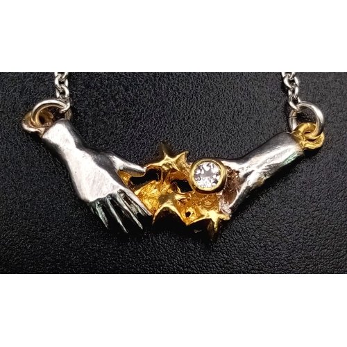 1101 - Alex Monroe Sterling Silver Necklace of 2 hands.
All Proceed go to charity on this lot.
 weighs 3.26... 