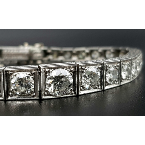 15 - A Time-Stopping Graduated 6ct (approx) Diamond and Platinum Ladies Bracelet. 32 brilliant round cut ... 