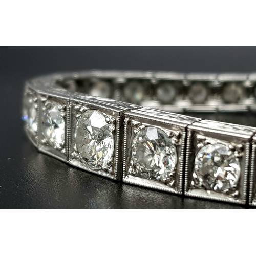 15 - A Time-Stopping Graduated 6ct (approx) Diamond and Platinum Ladies Bracelet. 32 brilliant round cut ... 