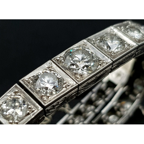 15 - A Time-Stopping Graduated 6ct (approx) Diamond and Platinum Ladies Bracelet. 32 brilliant round cut ... 