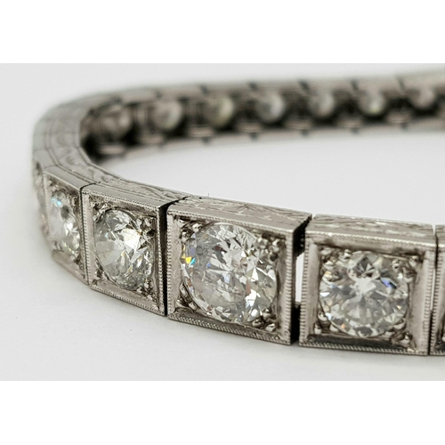 15 - A Time-Stopping Graduated 6ct (approx) Diamond and Platinum Ladies Bracelet. 32 brilliant round cut ... 