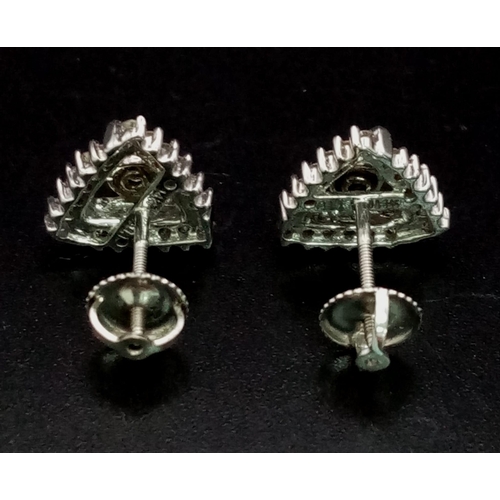 664 - 14k White Gold Diamond Stud Earrings. weighs 3g