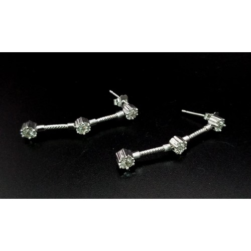 570 - 18k White Gold Diamond set drop Earrings 
0.50ct Diamonds
Weighs 3.6g