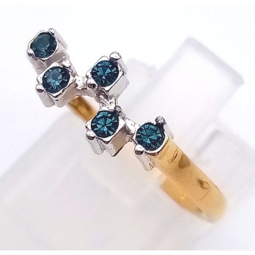 746 - A 9K Yellow Gold Ring with Blue and White Stones. Size L
1.5g total weight And a Pretty Yellow Metal... 