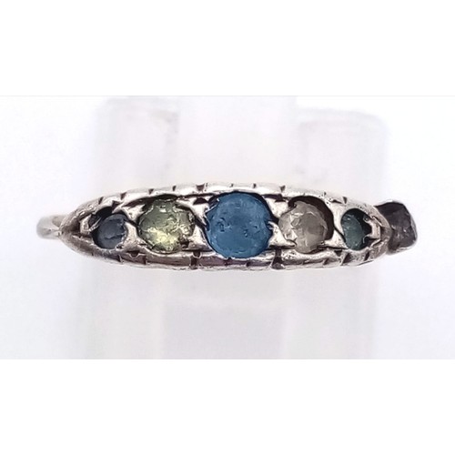 746 - A 9K Yellow Gold Ring with Blue and White Stones. Size L
1.5g total weight And a Pretty Yellow Metal... 