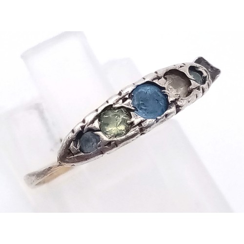 746 - A 9K Yellow Gold Ring with Blue and White Stones. Size L
1.5g total weight And a Pretty Yellow Metal... 