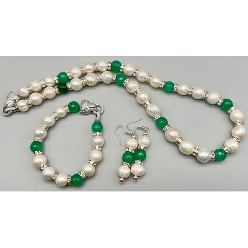 218 - A glamorous necklace, bracelet and earrings set with large (11-12 mm) natural, round, white pearls, ... 