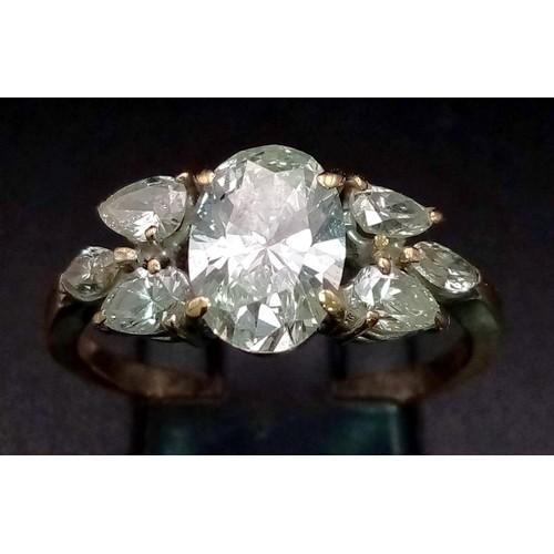 1427 - An 18K Gold and 2.5ct Diamond Ring. A breath-taking 1.5ct Central diamond with a further 1ct of diam... 