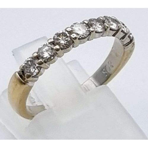 569 - An 18K Yellow Gold Diamond Half Eternity Ring. Eight diamonds - .8ct. Size O. 3.56g total weight.