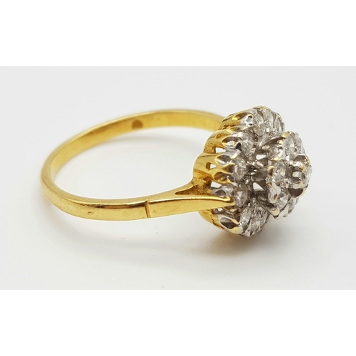 592 - An 18K Yellow Gold Diamond Cluster Ring. Floral shape - 1.0ct. H-VS Grade. Size P. 3.7g.