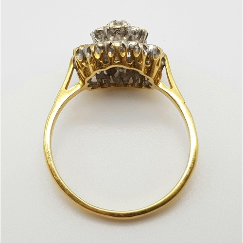 592 - An 18K Yellow Gold Diamond Cluster Ring. Floral shape - 1.0ct. H-VS Grade. Size P. 3.7g.