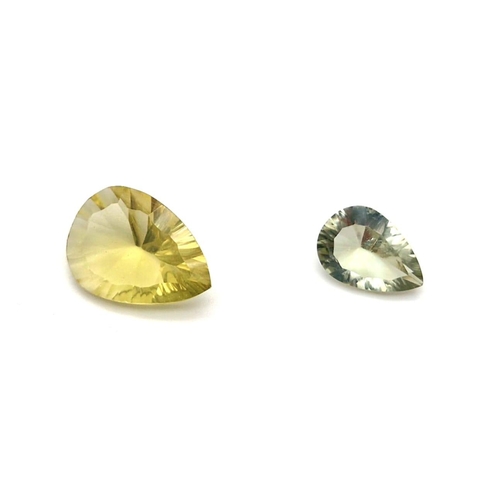 593 - Lot of 2 Gemstones - 10.85ct  Mixed Concave Cut Lemon Quartz and a 4.95ct Mixed Concave Cut Green Am... 