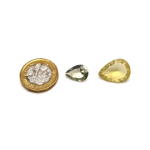 593 - Lot of 2 Gemstones - 10.85ct  Mixed Concave Cut Lemon Quartz and a 4.95ct Mixed Concave Cut Green Am... 