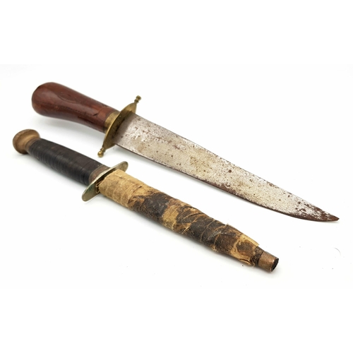 1103 - Two Vintage Daggers: An Indian dagger with hand carved handle and a Sheffield made small dagger with... 