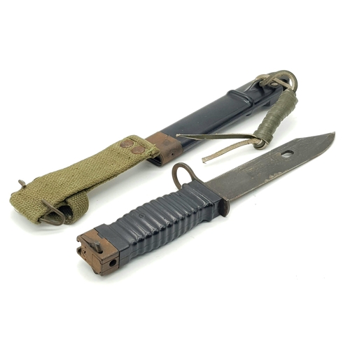 136 - A KCB-70  NWM Bayonet/Knife for the Stoner Rifle. Comes with sheaf and frog. Markings on blade. Good... 