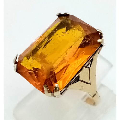 107 - A 9k Yellow Gold Citrine Ring. Rectangular-cut large citrine. Size J. 5.81g total weight.