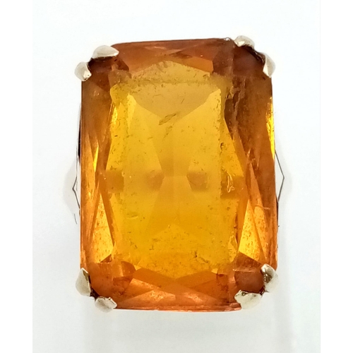 107 - A 9k Yellow Gold Citrine Ring. Rectangular-cut large citrine. Size J. 5.81g total weight.