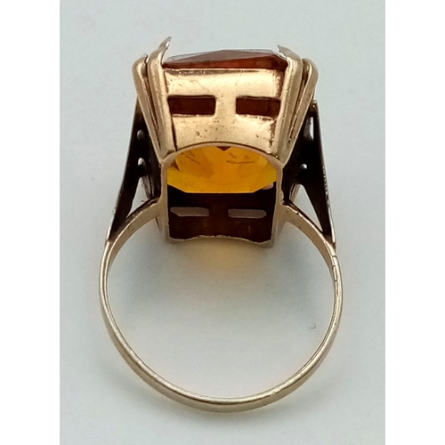 107 - A 9k Yellow Gold Citrine Ring. Rectangular-cut large citrine. Size J. 5.81g total weight.