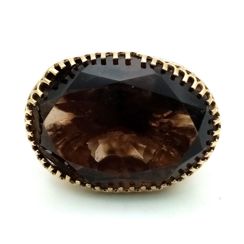 295 - An Antique Victorian Smoky Topaz set in Pinchbeck Pendant. Large oval smoky oval topaz on a scrolled... 