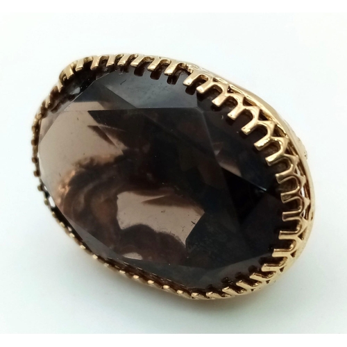 295 - An Antique Victorian Smoky Topaz set in Pinchbeck Pendant. Large oval smoky oval topaz on a scrolled... 