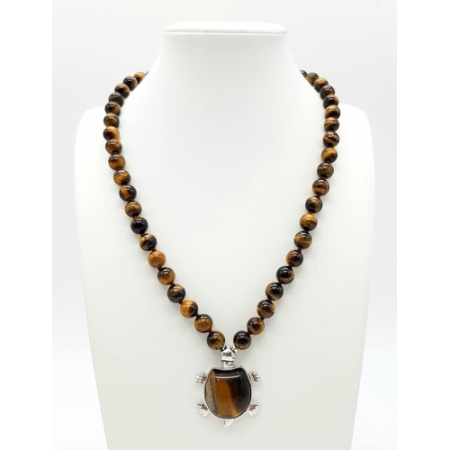 429 - A Tigers Eye Necklace with Tortoise Pendant - Plus a par of tigers eye drop earrings. Necklace - 44 ... 