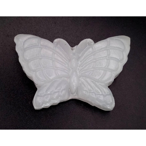 557 - A White Jade Butterfly Pendant. 5cm wingspan.